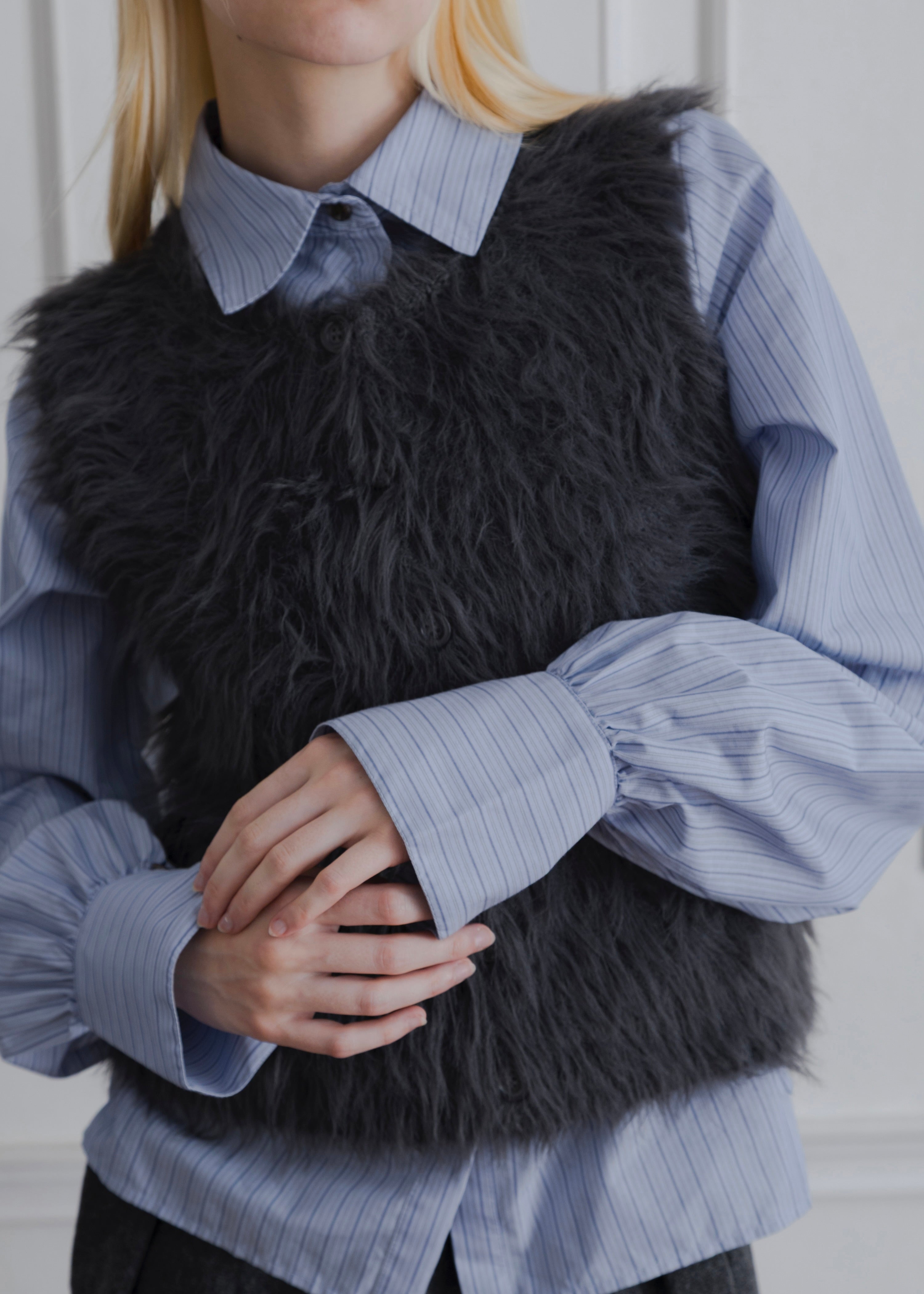 FEATHER VEST