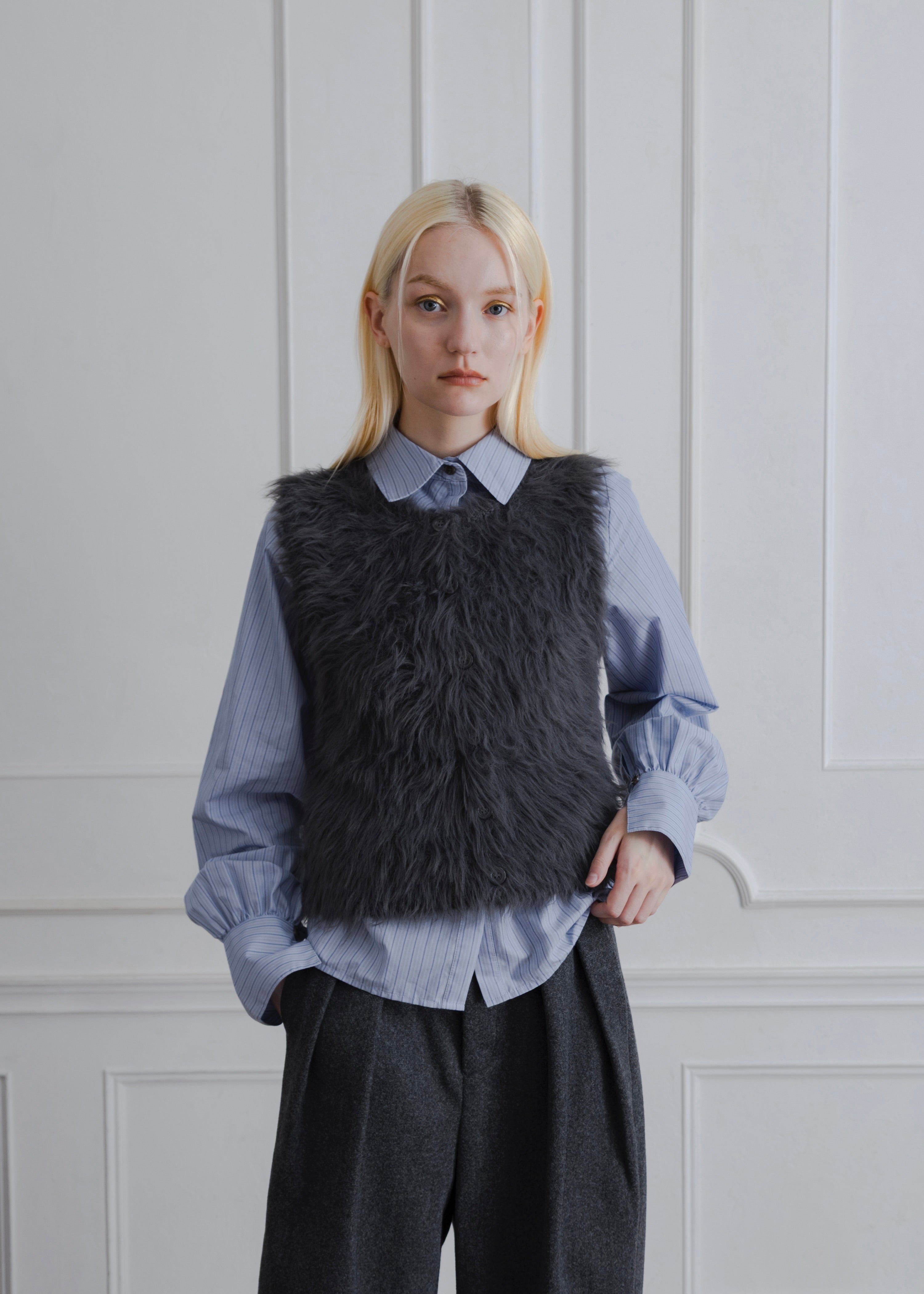FEATHER VEST