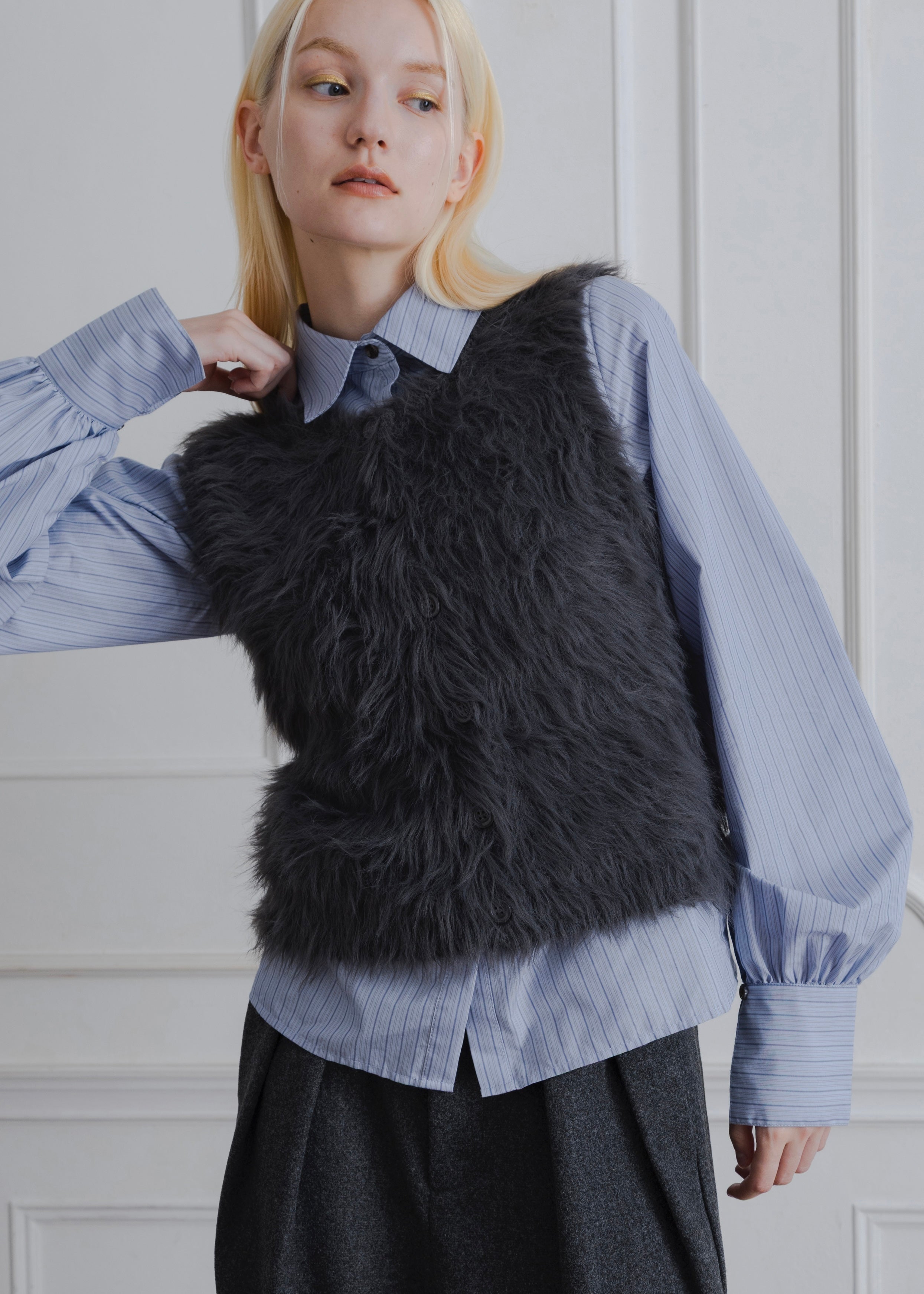 FEATHER VEST