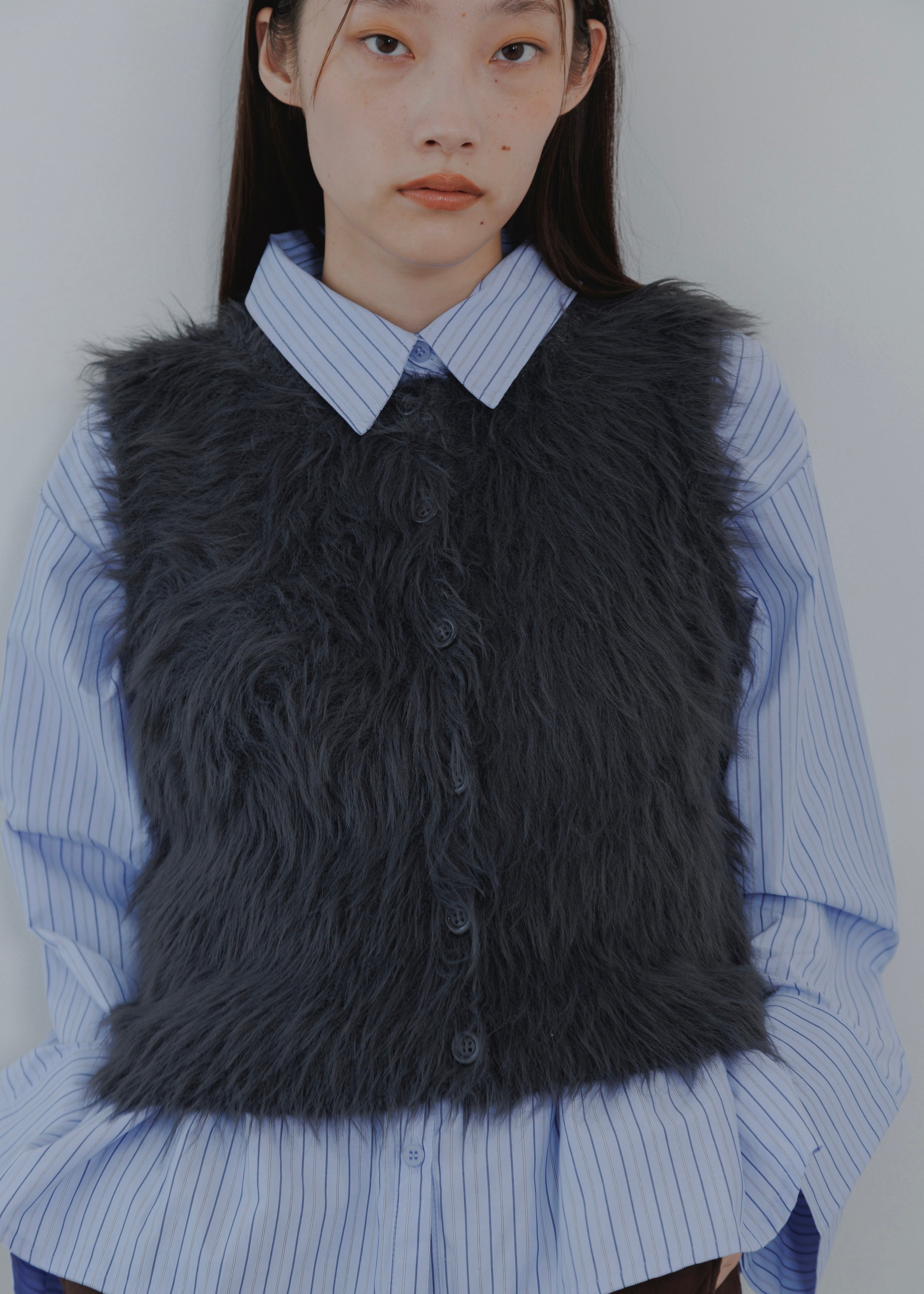 FEATHER VEST