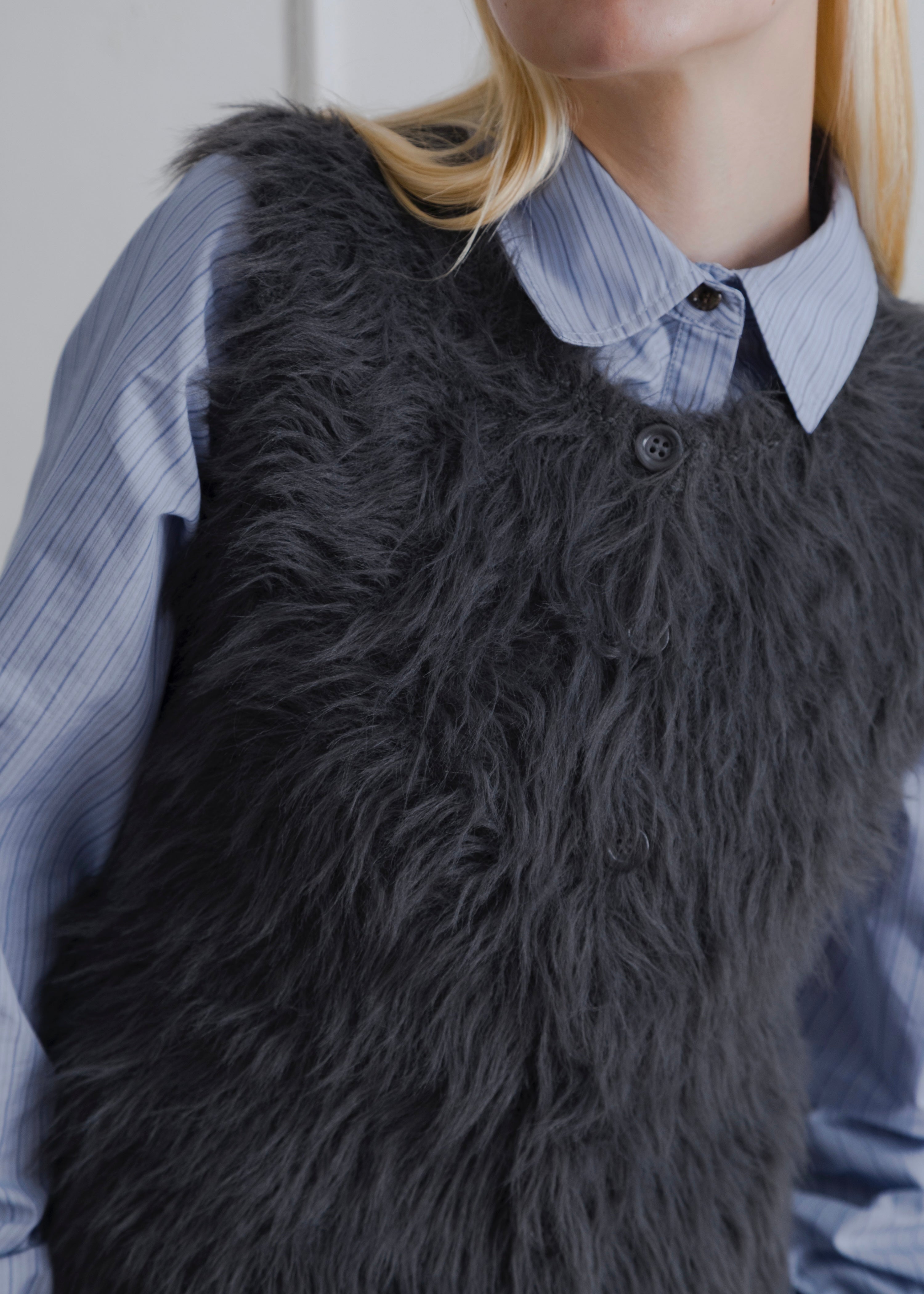 FEATHER VEST