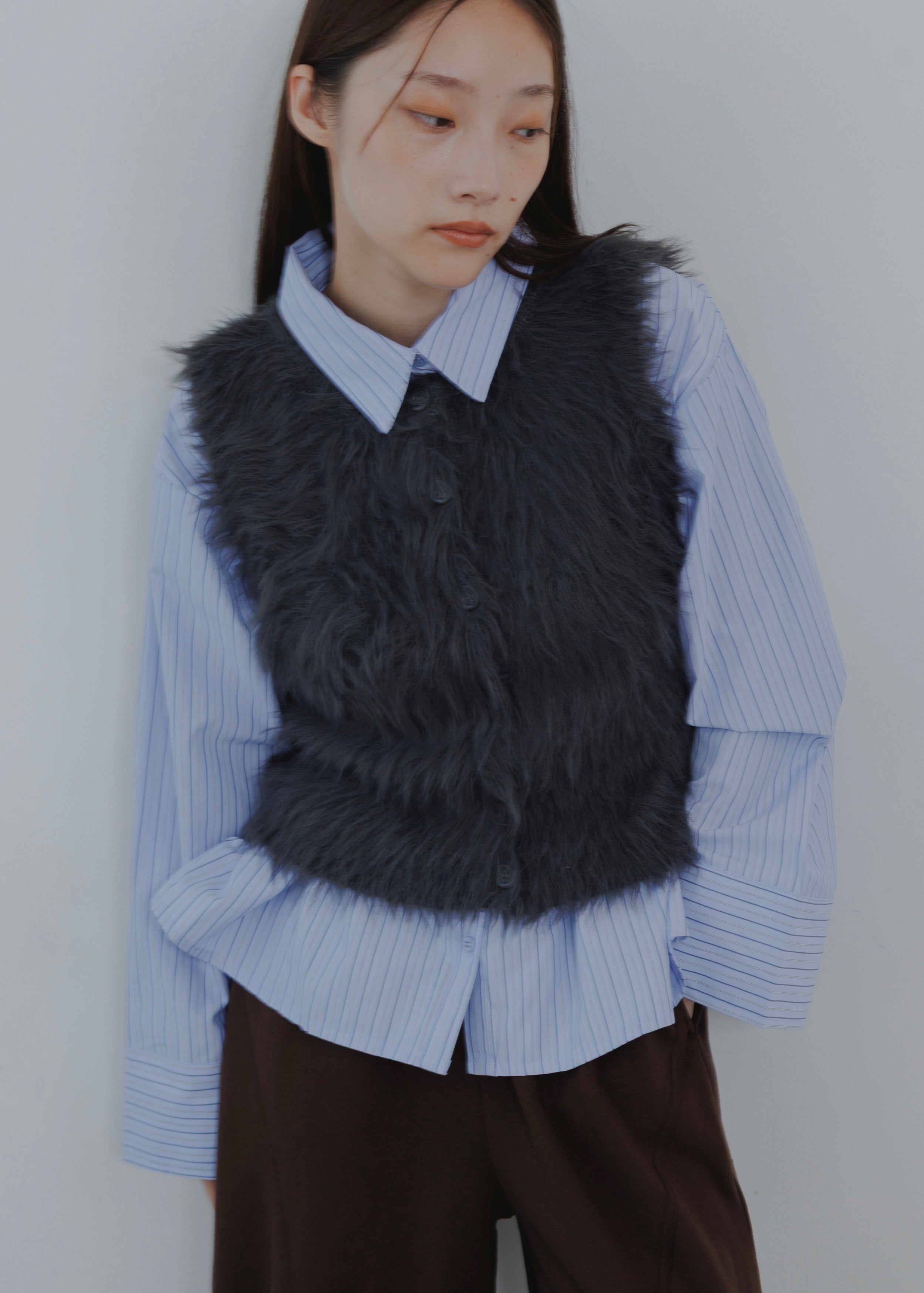 FEATHER VEST