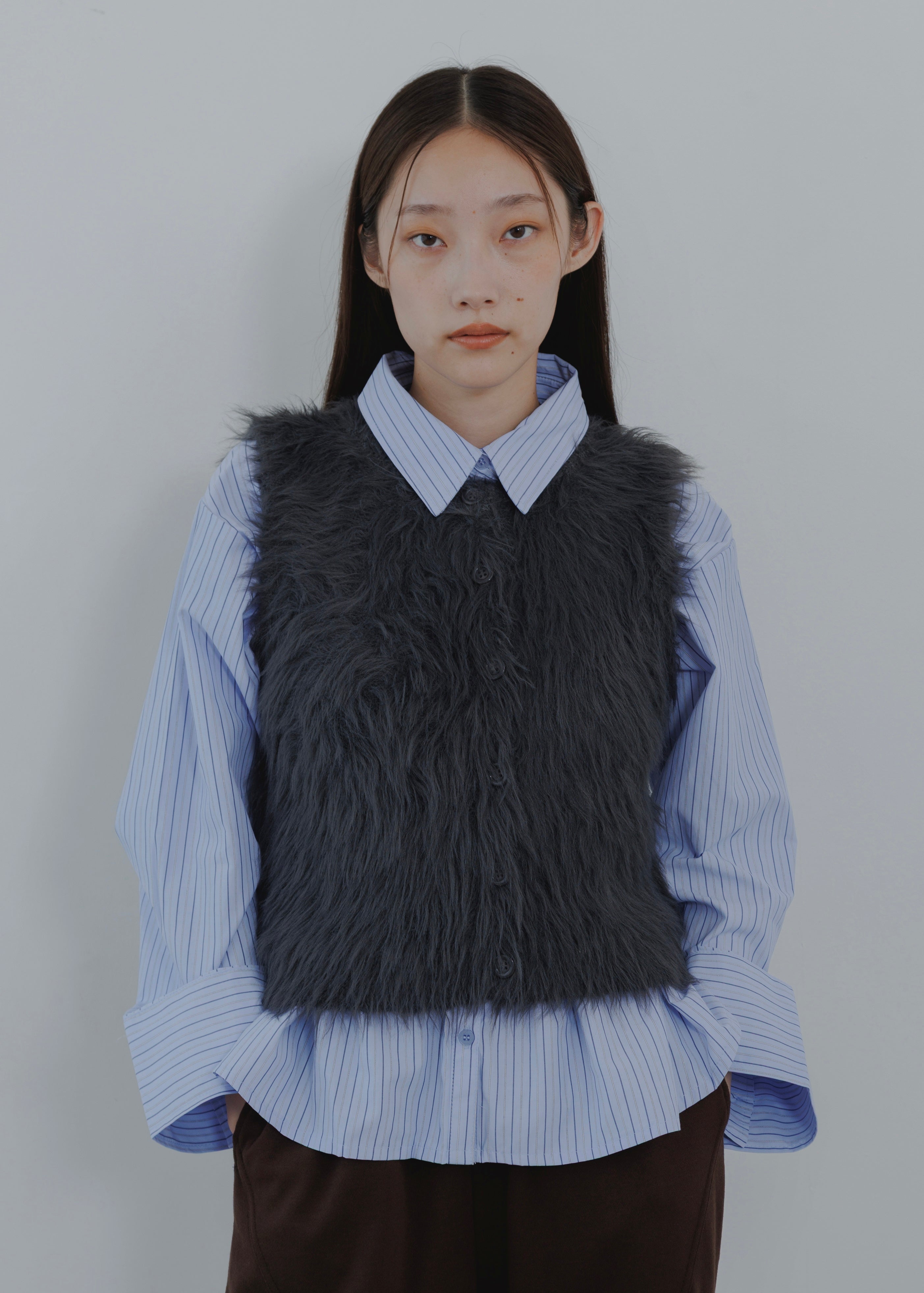 FEATHER VEST