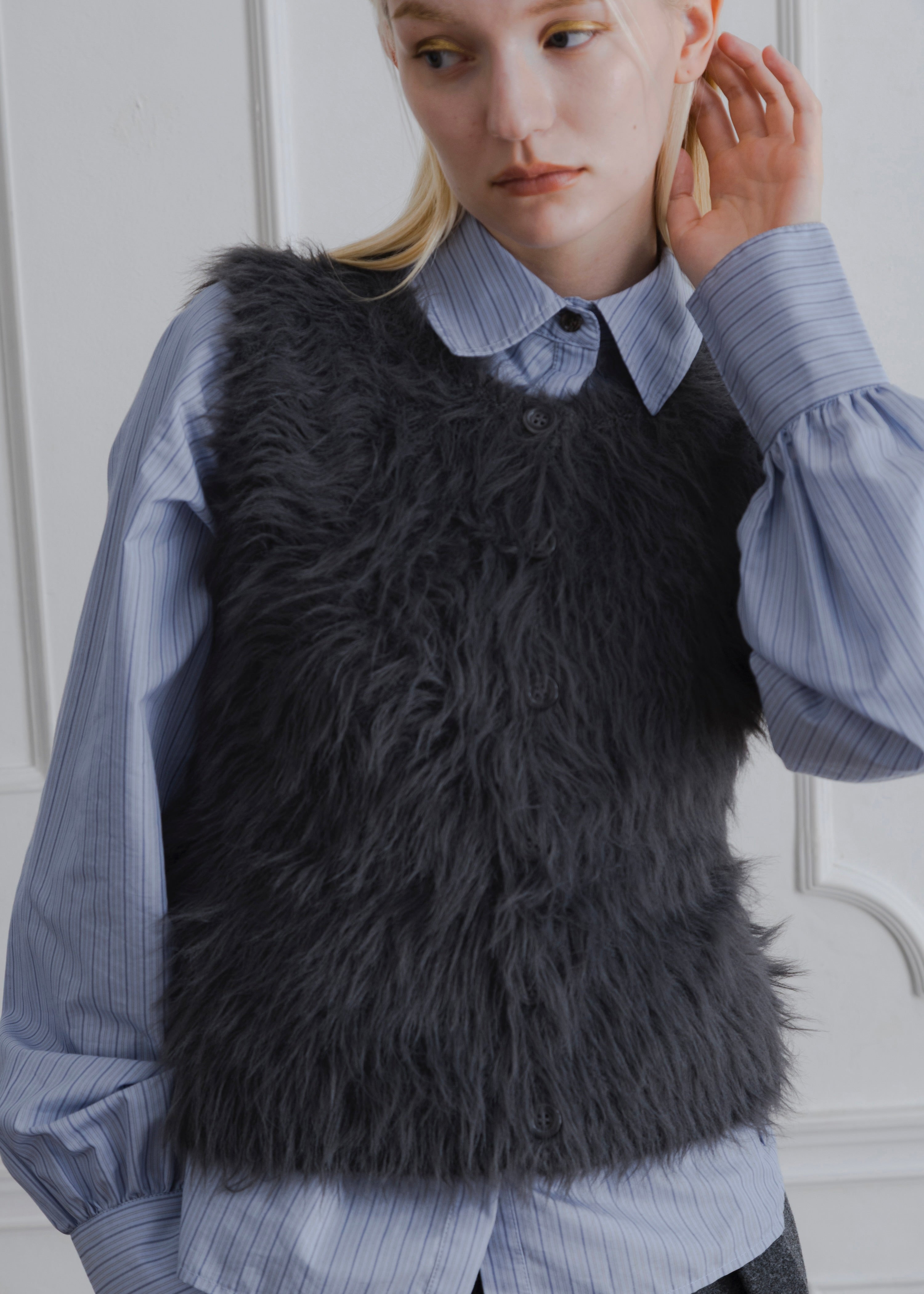 FEATHER VEST