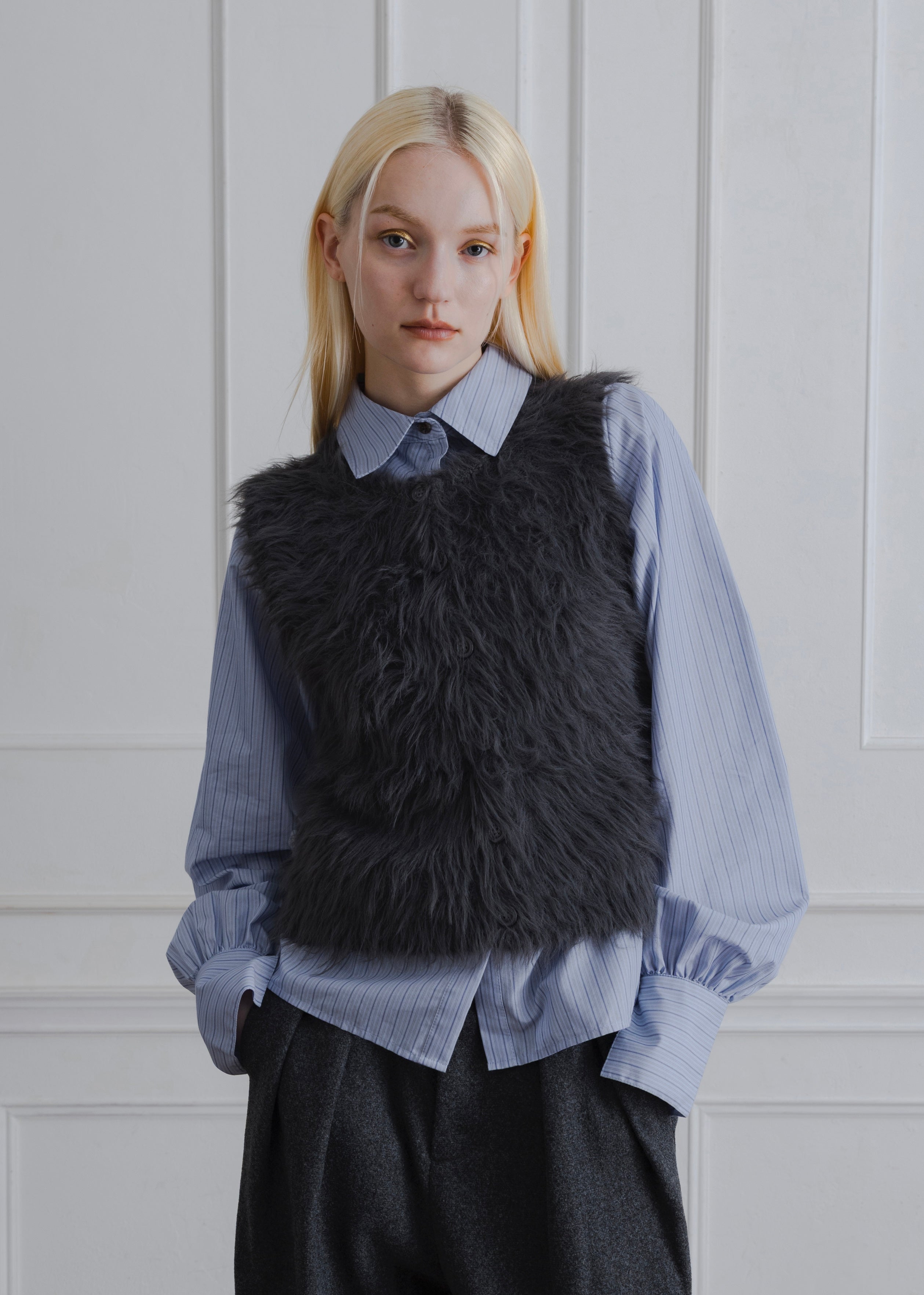 FEATHER VEST