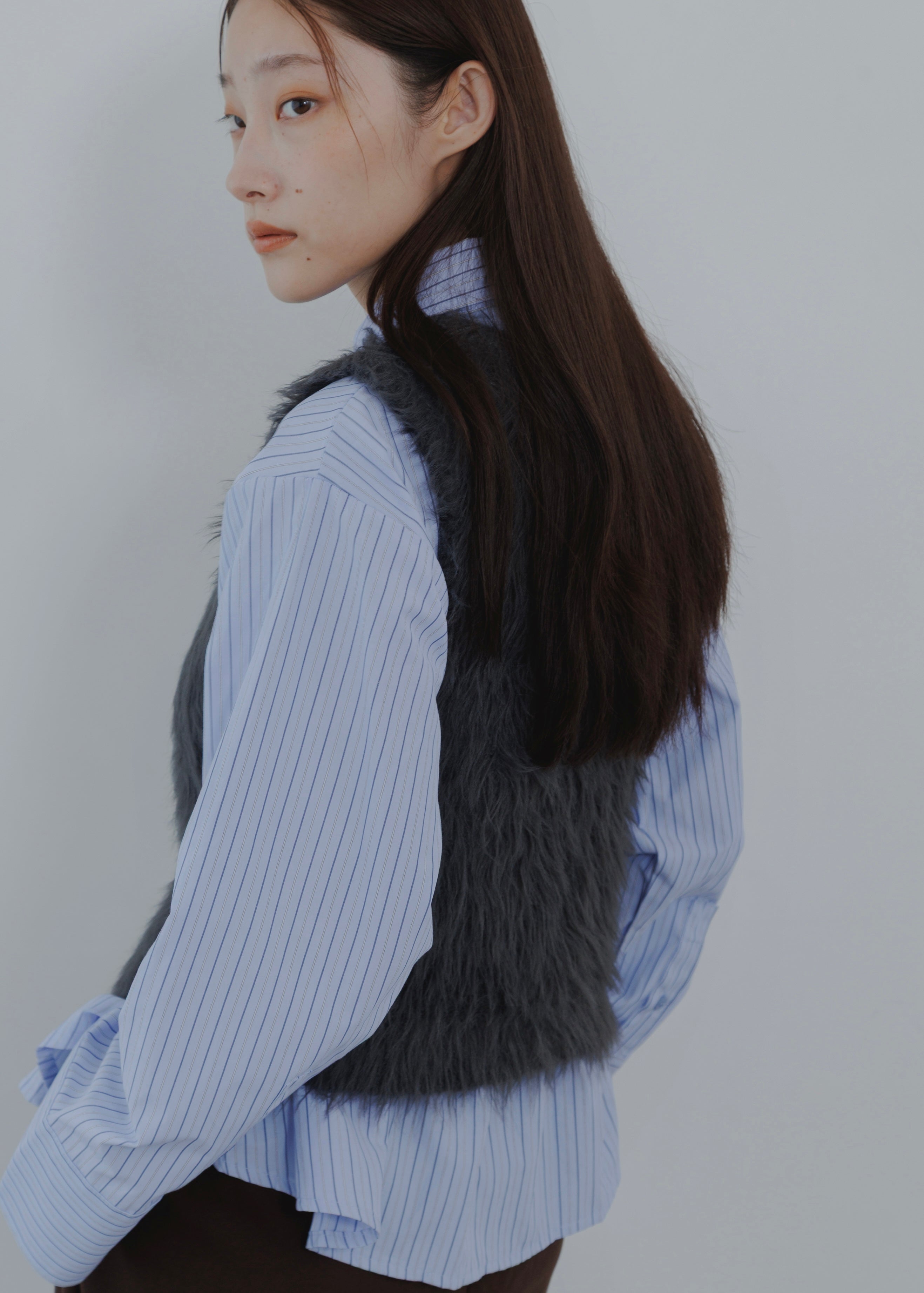 FEATHER VEST