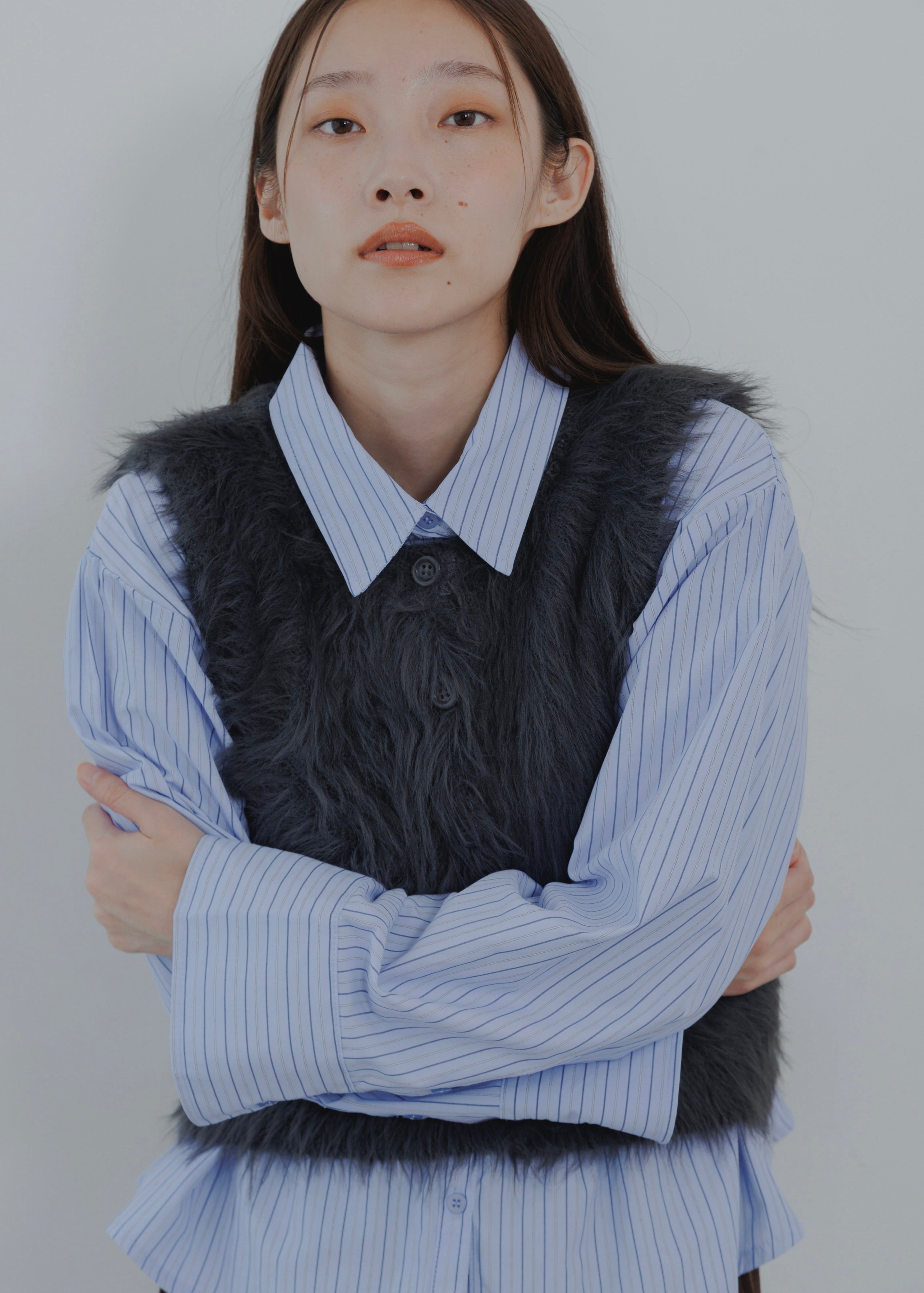 FEATHER VEST