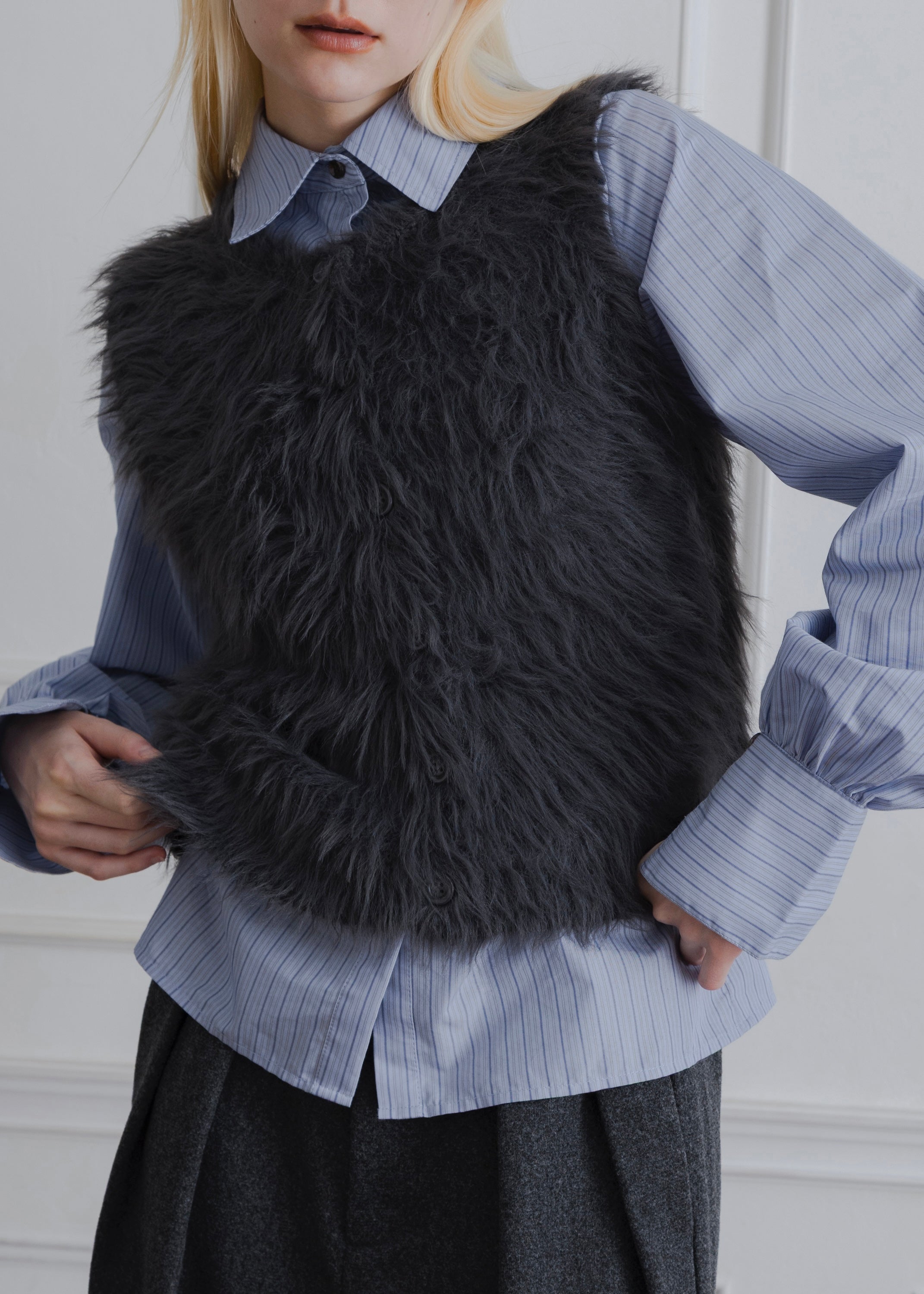 FEATHER VEST
